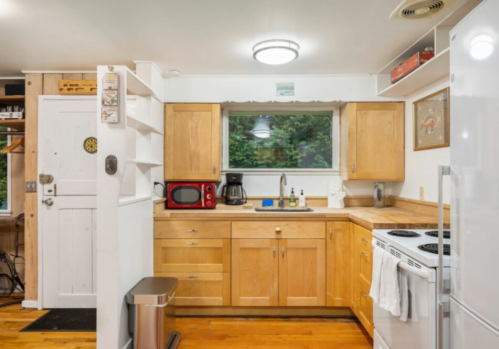 A full kitchen awaits your culinary adventures, whether it's microwave popcorn or your favorite dish.
