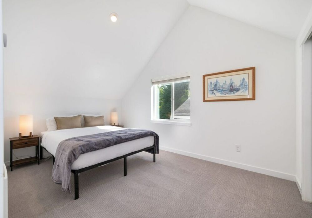 The main bedroom features a queen sized bed.