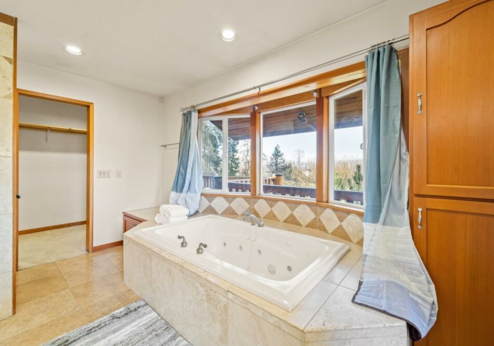 Primary bathroom with separate tub and shower