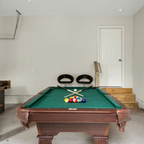 Garage includes a pool table + foosball table that can also be turned in to table tennis.