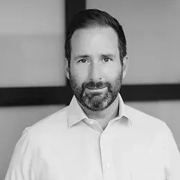 Headshot of Co-Founder and CEO, Adam Knight, experienced leader in vacation rental management, showcasing our professional commitment to excellence in the industry.