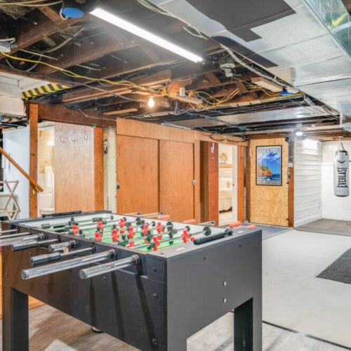 The foosball table in the basement is ready for you.