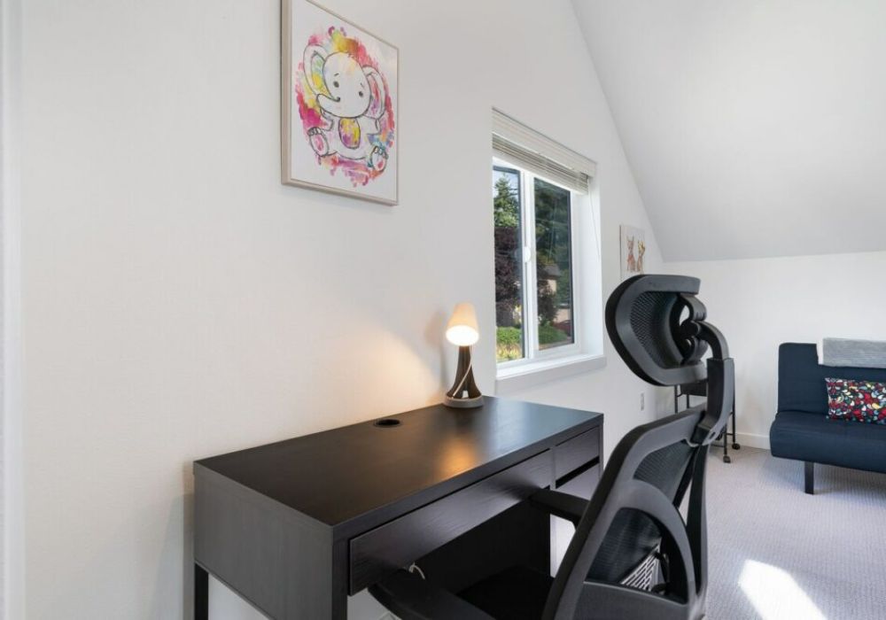 The second bedroom includes a desk, desk chair and futon suitable for 1 person.
