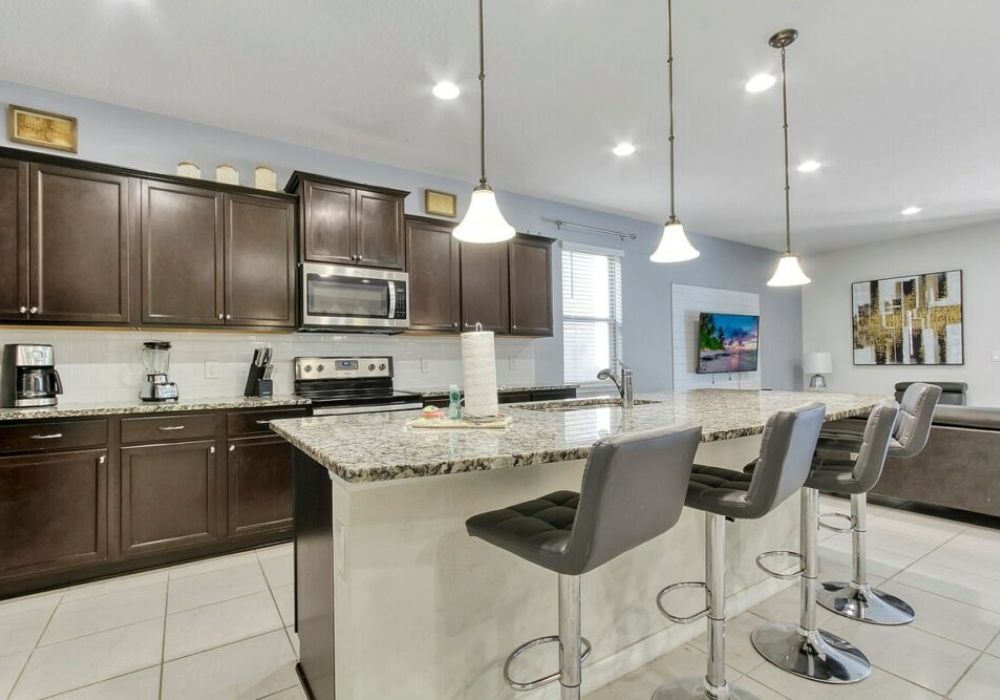 Fully equipped kitchen with extra seating around the island.