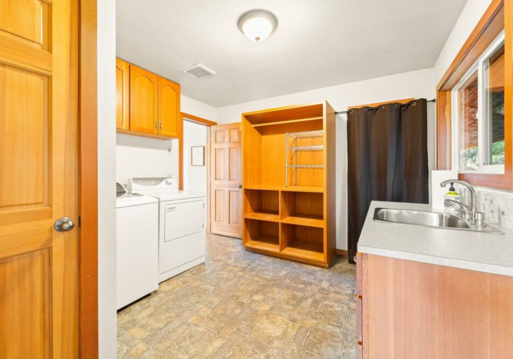 1 of 2 laundry rooms at the house, this one located just off the kitchen.