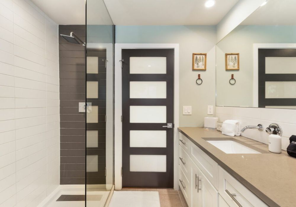 Step into our master bathroom's stand-up shower for a revitalizing start or a soothing end to your day.